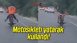 Motosikleti yatarak kullandı!