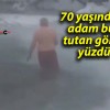 70 yaşındaki adam buz tutan gölde yüzdü