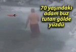 70 yaşındaki adam buz tutan gölde yüzdü